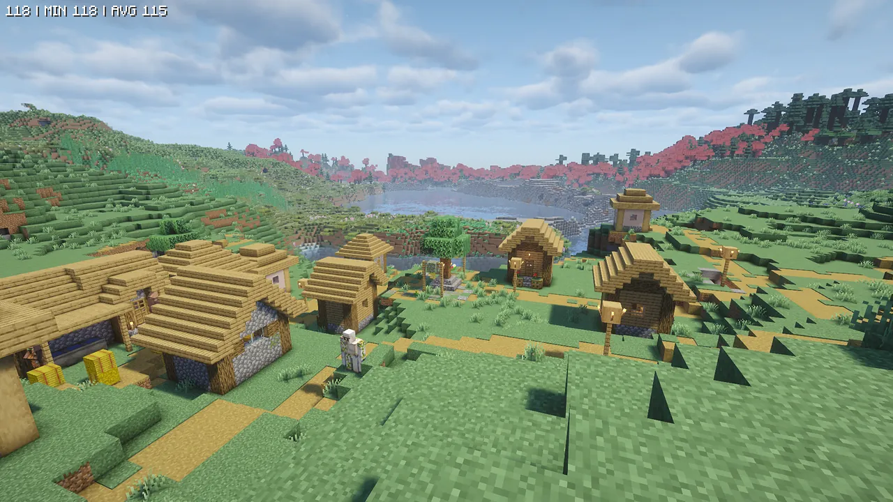 「Complementary Shaders - Unbound」を適用した村。リアルな雲の表現と透明感のある水面、そして柔らかい日光が差し込み、景色全体のディテールが向上しています。