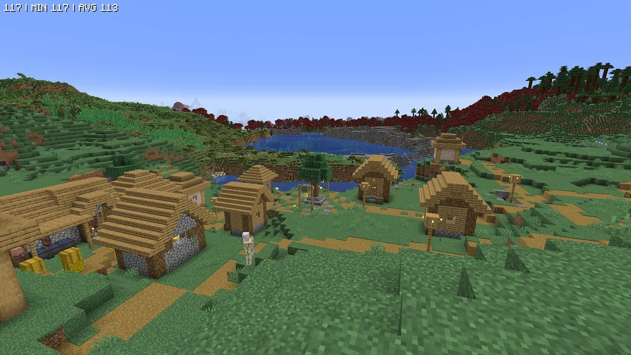 Modパックをバニラ状態で描画した村。遠景には赤い葉の木々が広がるカスタムバイオームが見え、Mod特有の不気味な自然環境が確認できます。
