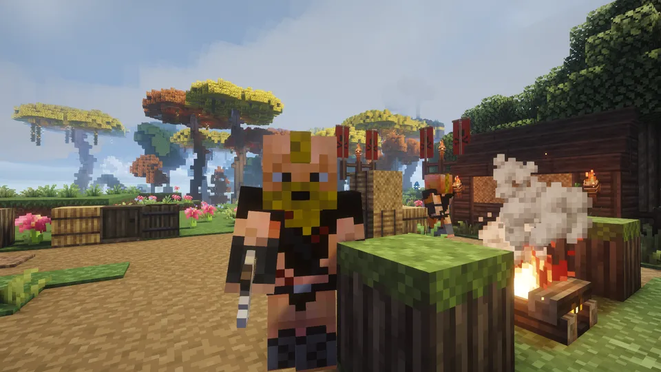 「Medieval MC」の冒険中に遭遇した、野営地に潜む敵対的な蛮族MOBのクローズアップ。黄色いマスクと黒い装束を纏った刺客のような外見で、背後には焚き火の煙が立ち昇る木造の小屋と、髑髏が描かれた赤い不気味な旗が配置されています。