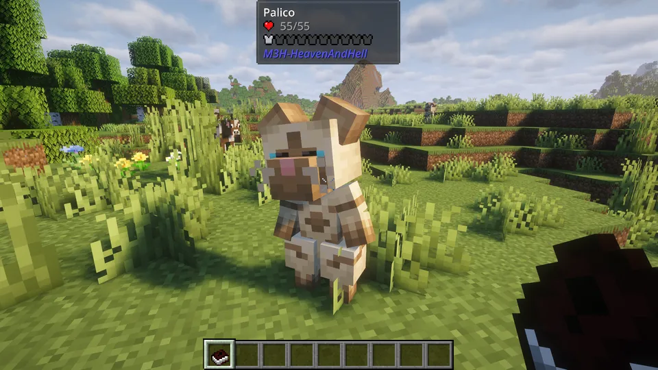 Monster Hunter: Heaven and Hell Modの「アイルー（Palico）」。二足歩行をする可愛らしい猫のキャラクター。草むらの中でプレイヤーを助ける相棒（オトモ）として佇んでいる様子。