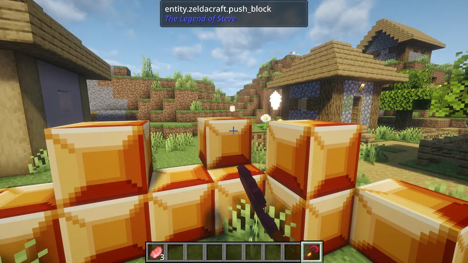The Legend of Steve Modの仕掛けブロック「push_block」。オレンジ色に輝く大きな四角いブロックが村の中に設置されており、特定のアイテムを使って押したり引いたりしてギミックを解くゼルダ風のアクションシーン。